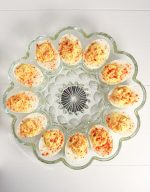 Overhead shot of deviled eggs in a circle glass platter