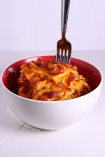 fork standing up in bowl of spaghetti carbonara with butternut squash noodles