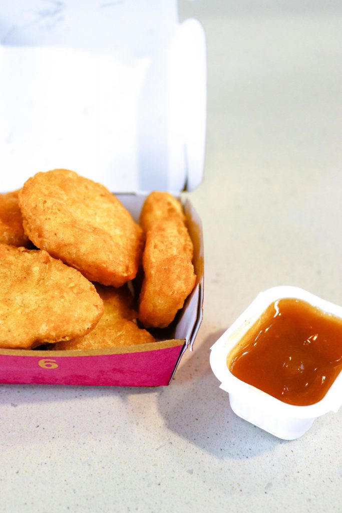 McDonald's chicken nuggets with sweet and sour sauce on the side