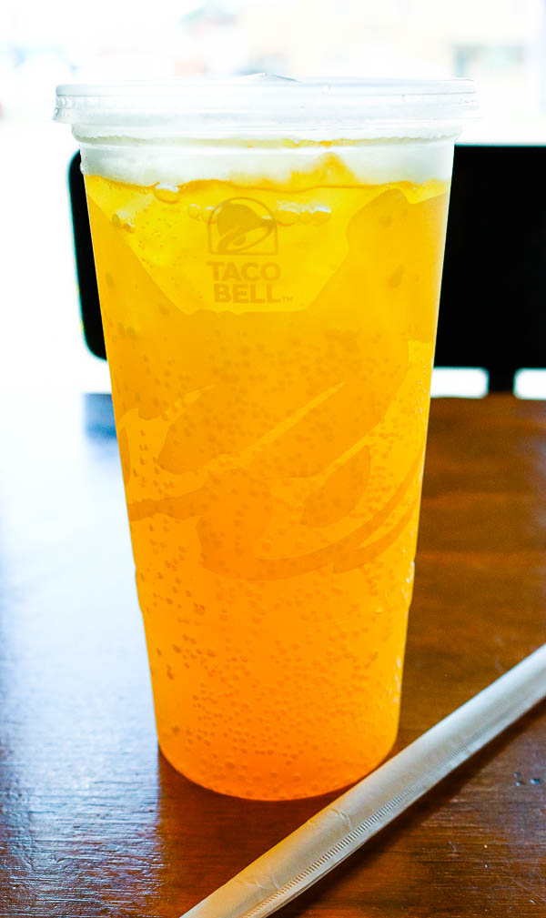 Taco Bell cup with orange drink