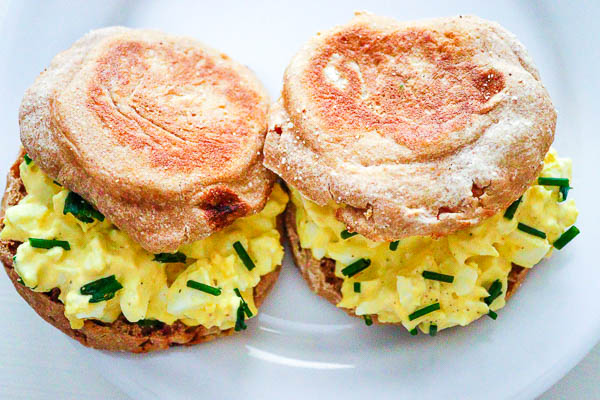 two egg salad sandwiches on English muffins