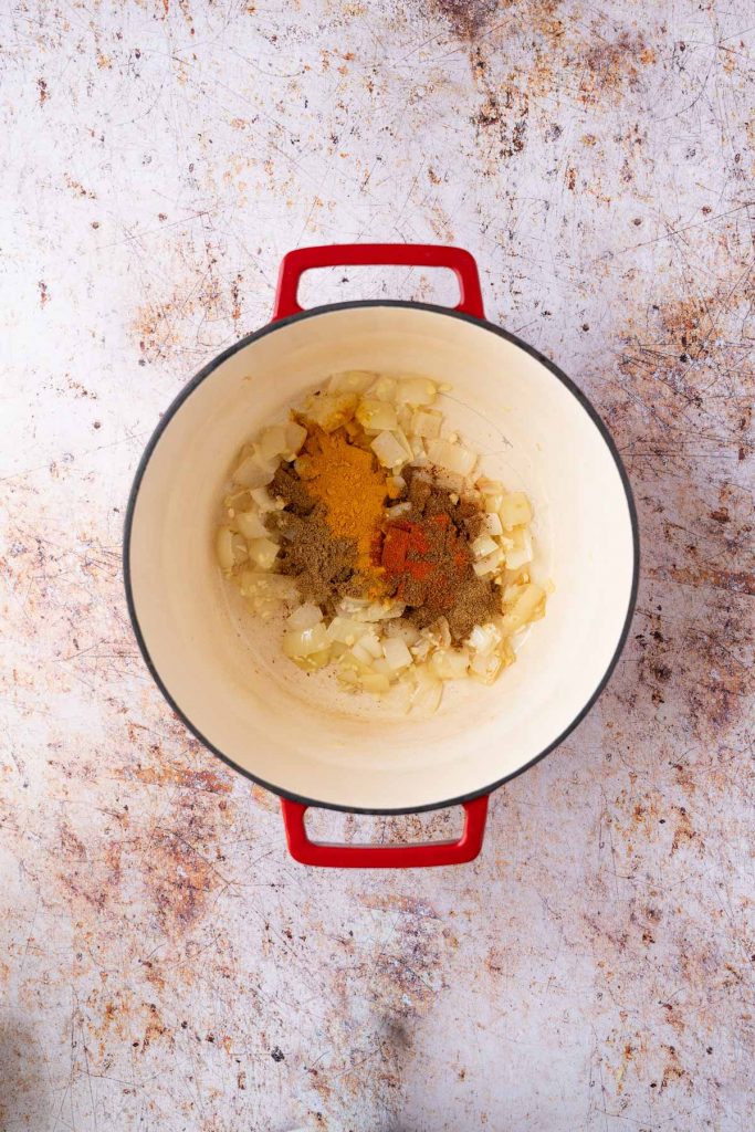 Spices added to pot with onions, garlic and ginger.